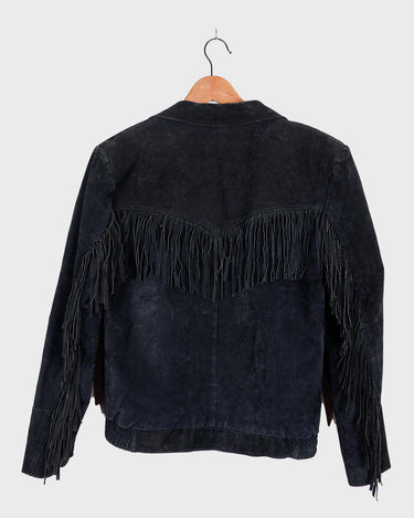 Classy with a hint of wild! This vintage 80s black fringe leather jacket features edgy shoulder pads and flowing fringes. Make a style statement fit for any sassy bohemian lover! 