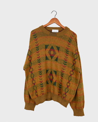 This vintage sweater has fall vibes written all over it, thanks to its alpaca and lambs wool mix in a cozy brown, mustard-yellow combo! 
