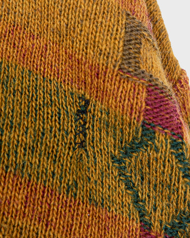 This vintage sweater has fall vibes written all over it, thanks to its alpaca and lambs wool mix in a cozy brown, mustard-yellow combo! 