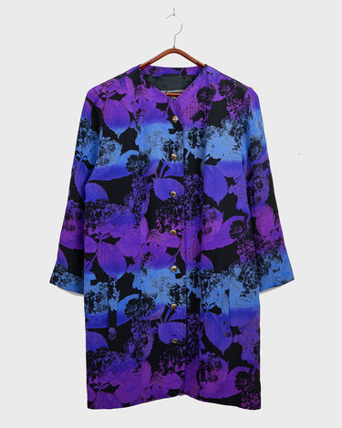 Vintage 80s, floral and fearless. Wear it open as a coat or buttoned up as a dress – either way, it’s a look. Statement gold buttons, bold print, and zero effort. For those who don’t just wear vintage – they own it.