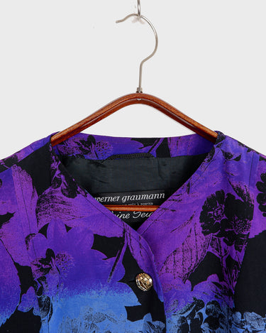 Vintage 80s, floral and fearless. Wear it open as a coat or buttoned up as a dress – either way, it’s a look. Statement gold buttons, bold print, and zero effort. For those who don’t just wear vintage – they own it.