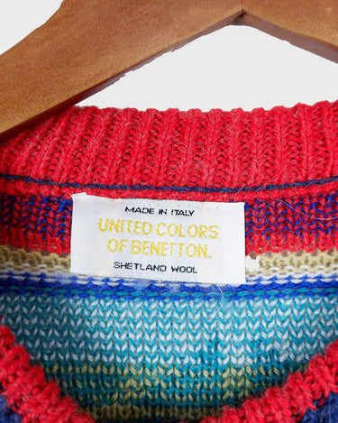 Stay warm and rainbow-bright with this eye-catching United Colors of Benetton shetland wool sweater! Featuring a vibrant array of colors, this classic piece will be sure to up your style game! It's perfect for any season!