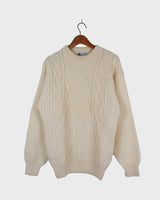 This vintage 90s white wool cable knit sweater is sure to become your comfy go-to! Throw it on and you'll instantly feel warm and cozy - this sweater's guaranteed to be your 'wear me anywhere' sidekick!