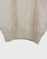 This vintage 90s white wool cable knit sweater is sure to become your comfy go-to! Throw it on and you'll instantly feel warm and cozy - this sweater's guaranteed to be your 'wear me anywhere' sidekick!