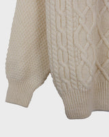 This vintage 90s white wool cable knit sweater is sure to become your comfy go-to! Throw it on and you'll instantly feel warm and cozy - this sweater's guaranteed to be your 'wear me anywhere' sidekick!
