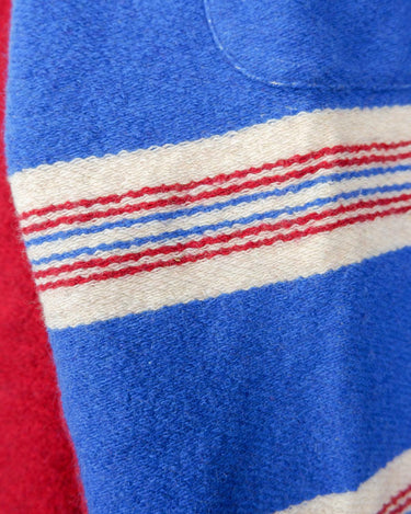 Get cozy in this vintage 90s red and blue striped half zip sweater. Perfect for those chilly days, this sweater is both stylish and comfortable. With its unique half zip design, you can easily adjust the neckline for the perfect fit.