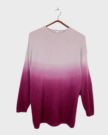 Wrap yourself in a hug with this vintage 90s cozy pink ombre colored sweater. Perfect for M - L sizes, this piece adds a pop of unique color to your wardrobe. Sweater weather, anyone?