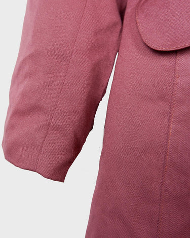 This vintage blazer in a striking dark pink is a must-have for any fashion-forward individual. Its long fit and two rows of buttons add a unique twist to any outfit. Whether you're dressing up for a formal event or adding some flair to your everyday look, this blazer has got you covered. (No time for boring fashion here!)