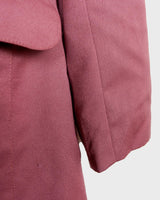 This vintage blazer in a striking dark pink is a must-have for any fashion-forward individual. Its long fit and two rows of buttons add a unique twist to any outfit. Whether you're dressing up for a formal event or adding some flair to your everyday look, this blazer has got you covered. (No time for boring fashion here!)