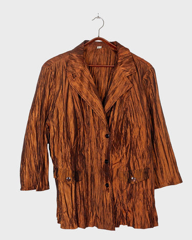 Spice up your outfit with this groovy 90s throwback blazer (very thin!)! The funky orange-brown hue will definitely catch some eyes, and the lightweight fabric is ideal for layering.
