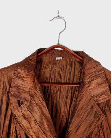 Spice up your outfit with this groovy 90s throwback blazer (very thin!)! The funky orange-brown hue will definitely catch some eyes, and the lightweight fabric is ideal for layering.