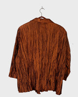 Spice up your outfit with this groovy 90s throwback blazer (very thin!)! The funky orange-brown hue will definitely catch some eyes, and the lightweight fabric is ideal for layering.