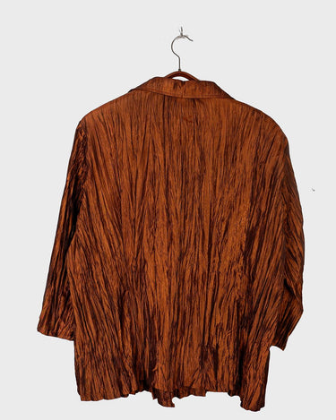 Spice up your outfit with this groovy 90s throwback blazer (very thin!)! The funky orange-brown hue will definitely catch some eyes, and the lightweight fabric is ideal for layering.