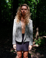 This vintage 80s Betty Barclay brocade blazer (thin) showcases a luxurious ornament pattern, embodying the bold elegance of power dressing. With its structured cut, lightly padded shoulders, and shimmering fabric, it adds a confident to any outfit. Finished with decorative statement buttons, it's a standout piece for a modern vintage wardrobe.