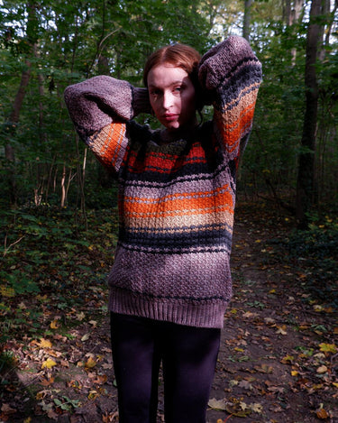Enhance your wardrobe with a touch of color through this vintage 80's pink sweater. Its XL size and vibrant stripes make for a playful addition to any outfit.