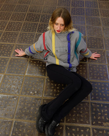Relive your 80s dreams in this vintage grey spring jacket (longer fit)! Its colorful stripes will give you a vibrant, bold look, while the removable hood adds versatility. SPICE IT UP!