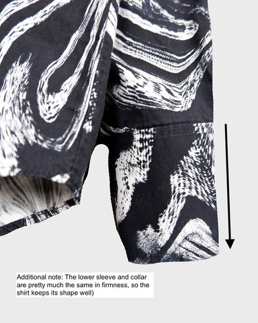 This black and white shirt doesn’t ask for attention — it just gets it. The abstract swirl pattern gives effortless chaos in the best way possible. Throw it on and let the print do the talking!