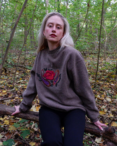 Get cozy in this Vintage 80s brown sweater, complete with beautiful floral stitching. Perfect for chilly days, this sweater is the ultimate way to stay snug. Cozyness is calling!