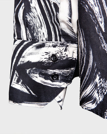This black and white shirt doesn’t ask for attention — it just gets it. The abstract swirl pattern gives effortless chaos in the best way possible. Throw it on and let the print do the talking!