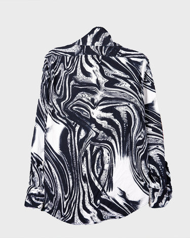 This black and white shirt doesn’t ask for attention — it just gets it. The abstract swirl pattern gives effortless chaos in the best way possible. Throw it on and let the print do the talking!
