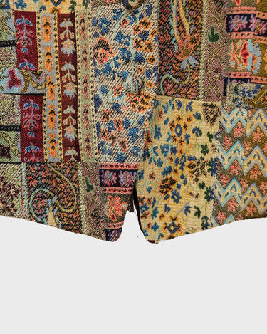 Embrace the vibes with our 80s/90s colorful pattern vest. This unique and detailed piece adds a touch of boho to your style!
