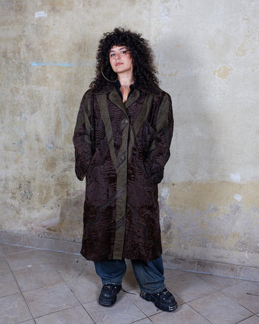 Add a touch of eccentricity to your wardrobe with this vintage 80s long brown leather fur coat. Featuring unique patchwork leather and a cozy fur lining, this XL-XXL coat is perfect for making a bold statement