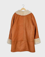 Leave the cold winter days behind and upgrade your wardrobe with this vintage 80s brown shearling coat! Luxuriously soft and cozy, it has a casual fit that makes it perfect for everyday wear. So why not give yourself a timrless 80s-inspired look? It'll definitely keep you!