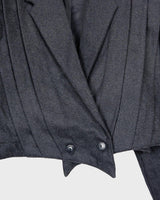 This timeless crop fit blazer gives you an '80s edge like no other! Its dark grey hue and signature shoulder pads will give you the edge you need to make a statement. Attitude included!