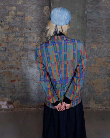 Meet your new spring must-have! Vibrant colors, quirky shoulder pads, and a flattering fit make this piece a true standout. Embrace this 80s vintage blazer.