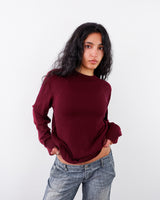 A women wears a Preloved burgundy silk and cashmer mix sweater | S-M from the online shop Vinti Vintage