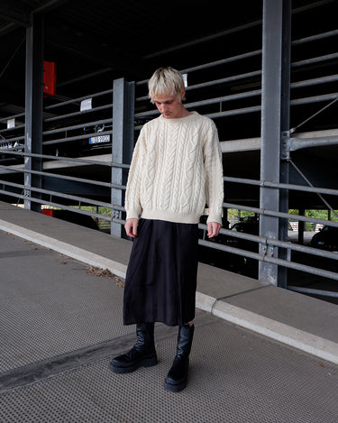 Snuggle up in this cream cable knit sweater from Blarney Woollen Mills, crafted from 100% new wool for lasting warmth and comfort. The soft, cozy texture makes it perfect for everyday wear. Its timeless cream shade ensures easy pairing with any outfit. A must have essential!
