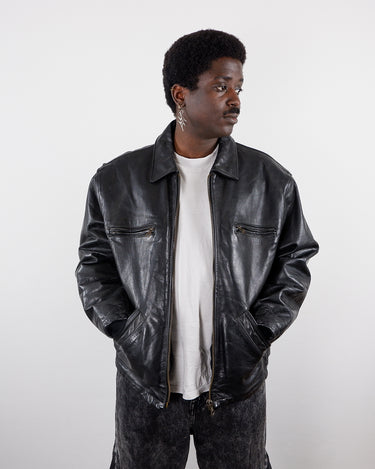  a man is wearing a Vintage 80s 90s 1957 LEGENDARY JACKET FIRENZE black leather jacket (heavy) by vinti vintage