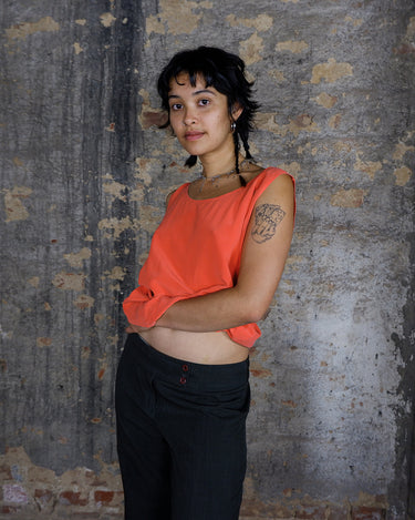 Silk tank top in vibrant coral, crafted from luxurious lightweight silk for a smooth and breathable feel. A classic essential designed for those who love timeless style.