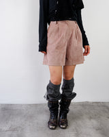 Exuding effortless elegance, these high-waisted pink shorts feature a soft faux-suede texture that redefines modern style. The impeccable tailoring flatters the silhouette while offering a seamless blend of classic chic and contemporary design.&nbsp;