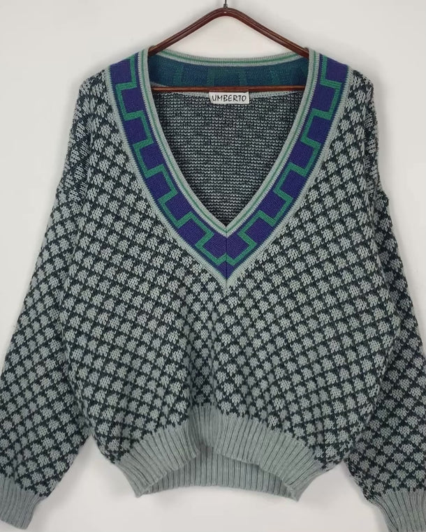 Unleash your laid-back vibe with this vintage 80s geometric v-neck sweater. Made with cozy wool, it's perfect for any chill day. As a unisex design, anyone can rock this sweater with ease.