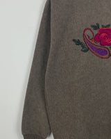 Get cozy in this Vintage 80s brown sweater, complete with beautiful floral stitching. Perfect for chilly days, this sweater is the ultimate way to stay snug. Cozyness is calling!