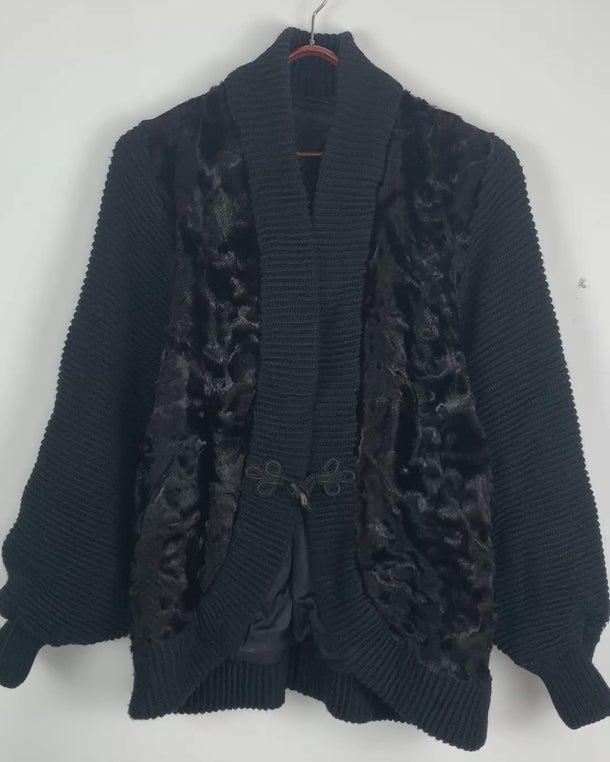 Expertly crafted with luxurious black wool and soft fur, this vintage 80s cardigan exudes timeless elegance and warmth. Perfect for sizes L - XL