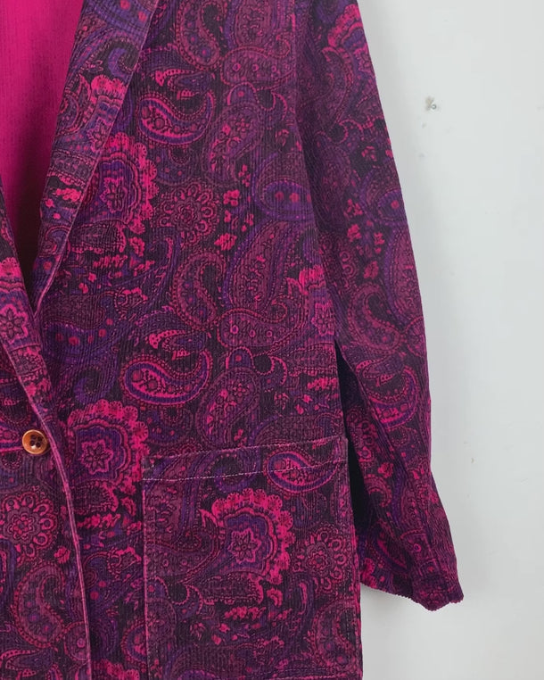 Upgrade your blazer game with this vintage 80s pink/purple paisley pattern blazer. This blazer is anything but boring.