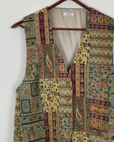 Embrace the vibes with our 80s/90s colorful pattern vest. This unique and detailed piece adds a touch of boho to your style!
