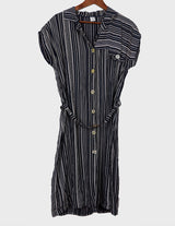 a woman is wearing a 90s vintage striped belted midi dress.