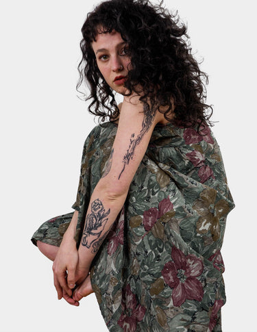 a woman is wearing a vintage 80s 90s floral boho maxi dress.