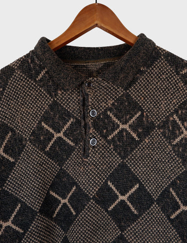 a woman is wearing a 80s brown vintage abstract pattern sweater.
