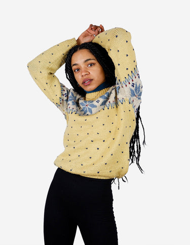 a woman is wearing a yellow sweater.