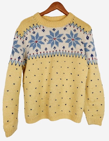 a woman is wearing a yellow sweater.