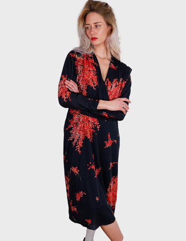 a woman with blonde hair is wearing a vintage 80s 90s floral maxi dress.