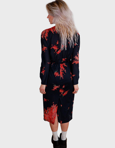 a woman with blonde hair is wearing a vintage 80s 90s floral maxi dress.