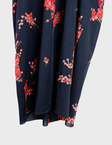 a woman with blonde hair is wearing a vintage 80s 90s floral maxi dress.