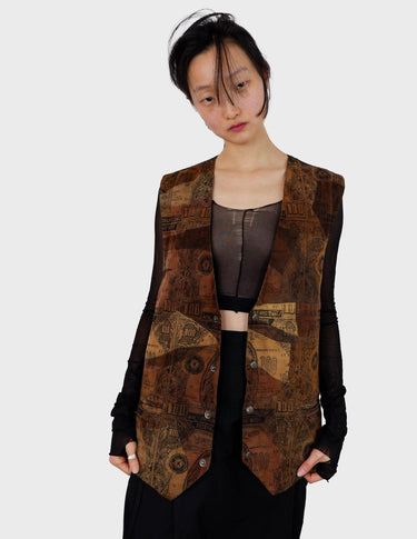 an asian woman is wearing a 90s vintage brown vest with historical pattern.