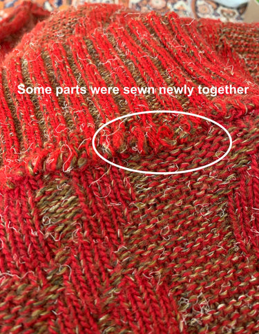 a woman isi wearing a vintage 90s cable knit sweater.